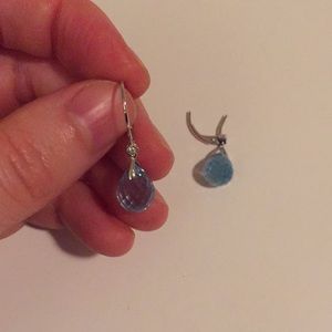 Broken topaz, diamond, and white gold earrings.